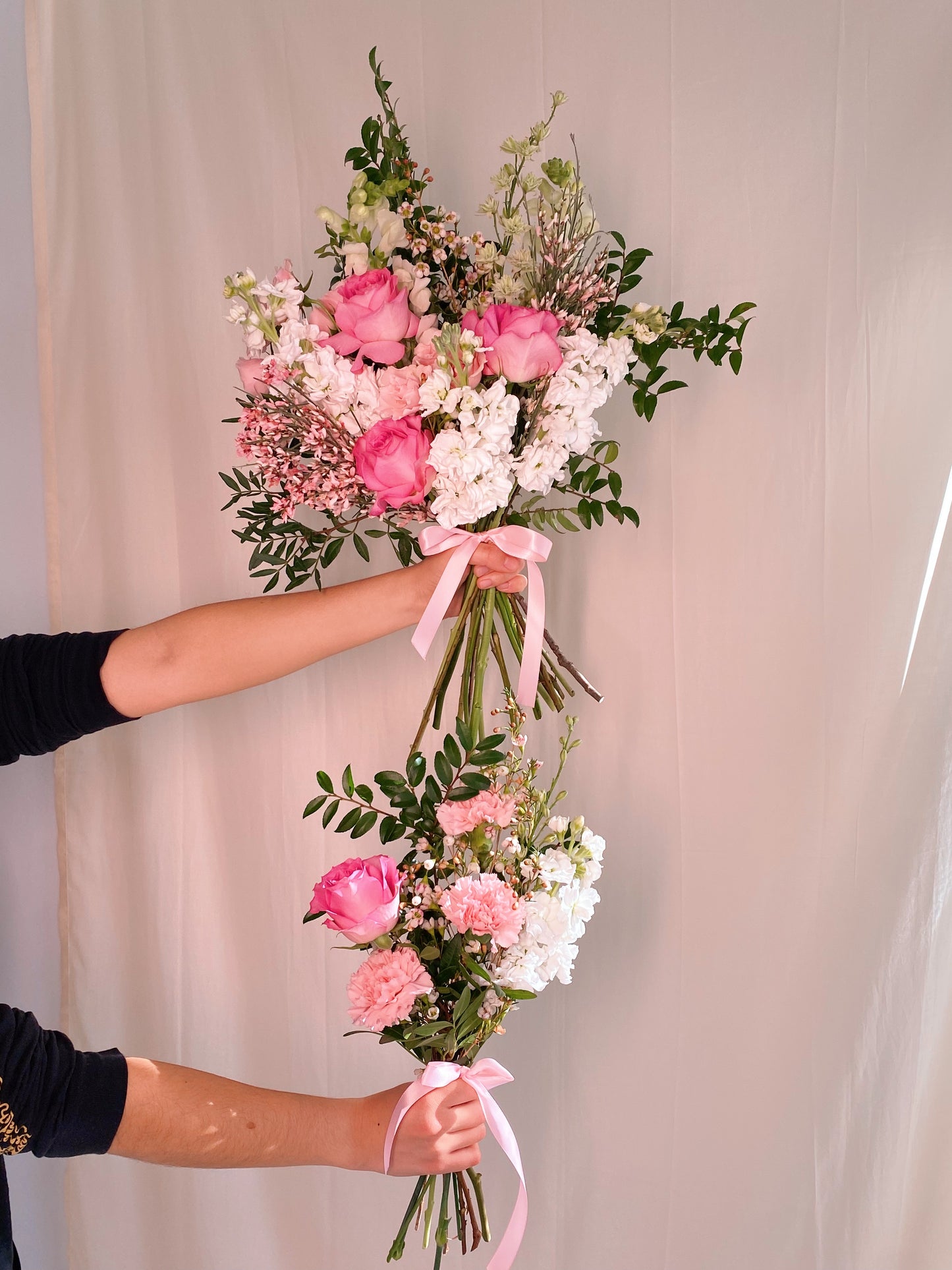 photo shows the difference between the 'graduation glory' bouquet size (top) and 'congradulations' bouquet (bottom)